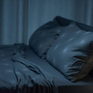 Contemporary clean bedroom interior with unmade bed, sleep and relax concept